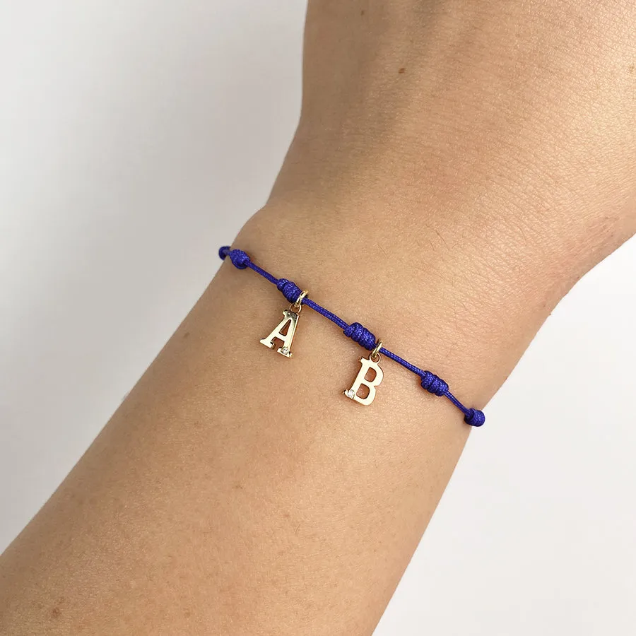 Pulsera con Inicial 7 nudos Azul 2 letras con Diamante y Oro